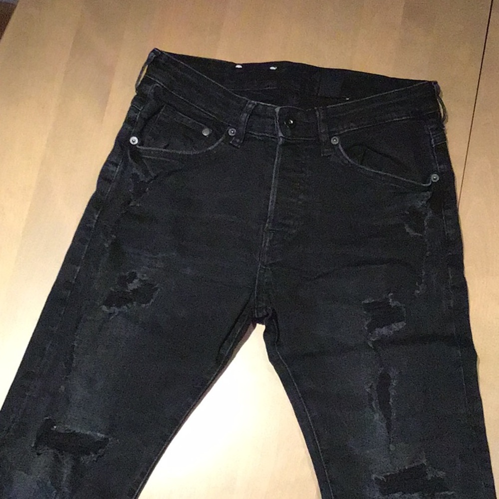 Black ripped H&M jeans